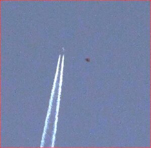 HUGH ALIEN CRAFT SHADOWING A COMMERCIAL FLIGHT
