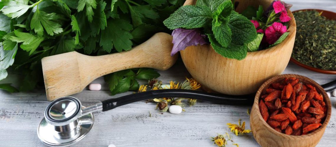 Alternative-Medicine-Herbs-Stethoscope-Wooden-Table.jpg