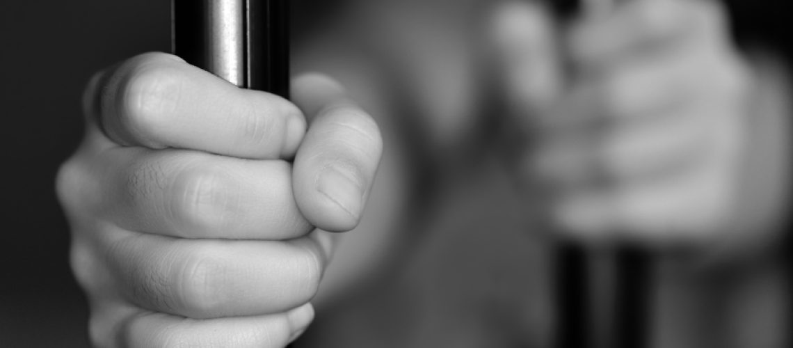 Arrested-Jail-Hands_341259684.jpg