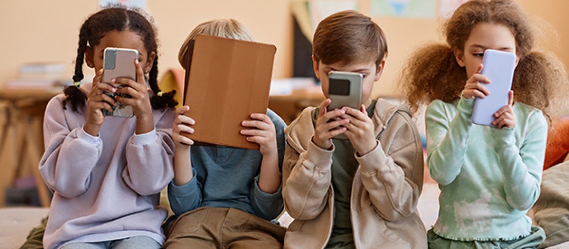 Group-of-young-children-holding-smartphones-1.jpeg