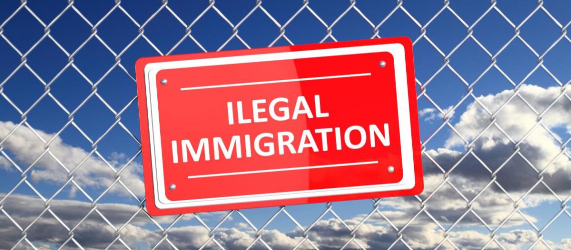 Illegal-Immigration-Red-Sign-Fence.jpg