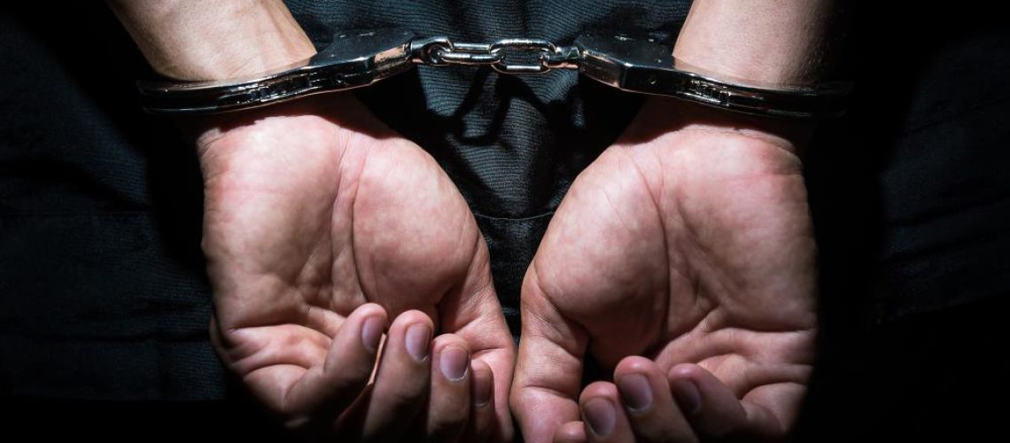 Man-Business-Criminal-Defense-Jail-Arrest-Back.jpg
