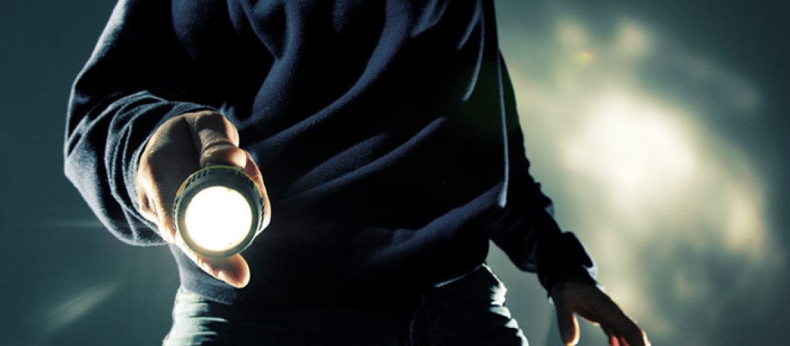 Man-Holding-Flashlight-LED.jpg