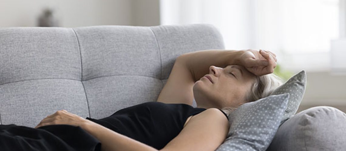 Peaceful-serene-mature-woman-lying-on-back-on-sofa-1.jpeg