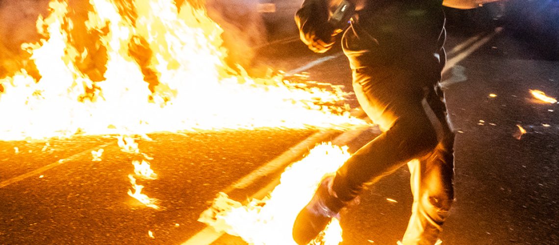 Protest-Riot-Buring-Man-Fire-Shoe.jpg