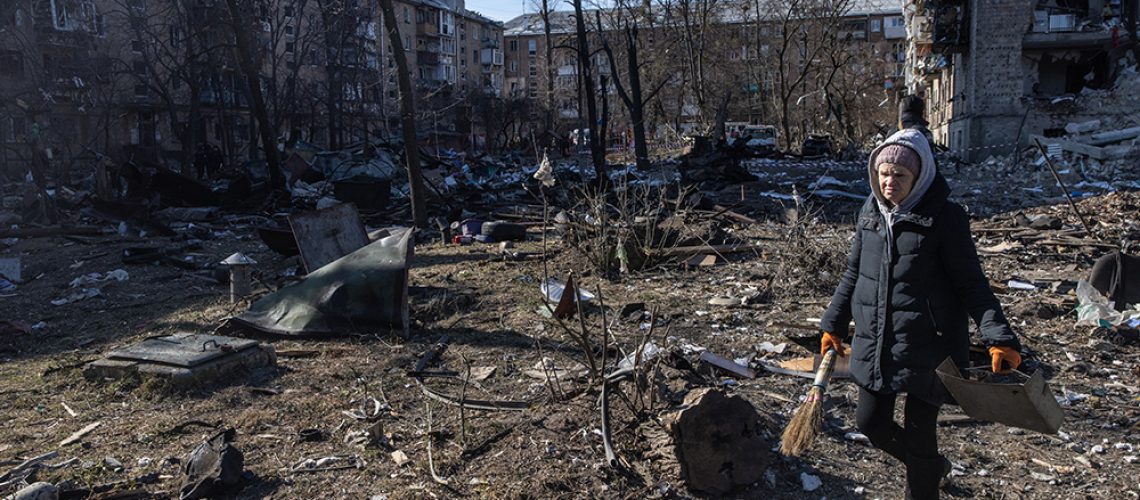 Ukraine-Russia-War-Kyiv-Woman-Debris-Apartment-Building.jpg