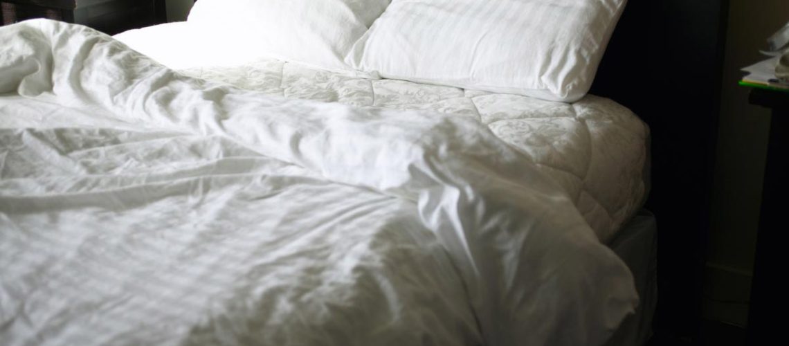 Unmade-Bed-Pillows-Sheets-Bedroom.jpg