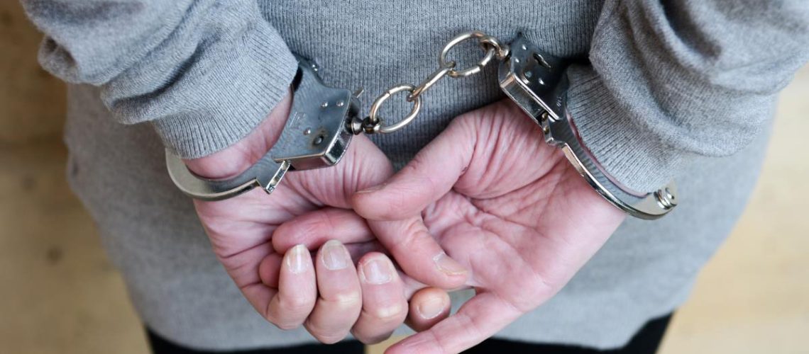 Woman-Arrest-Jail-Cuffs-Back-Female-Girl-1.jpg