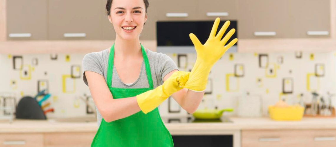 Woman-Green-Apron-Yellow-Rubber-Gloves-Clean-Kitchen.jpg