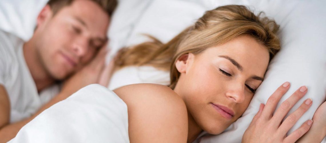 Young-Couple-Love-Sleep-Bed-Sheets-Pillows-Rest.jpg